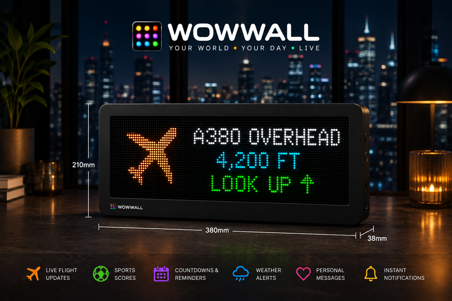 Wow Wall on a desk at night, a lit city skyline behind it, showing a live aircraft alert
