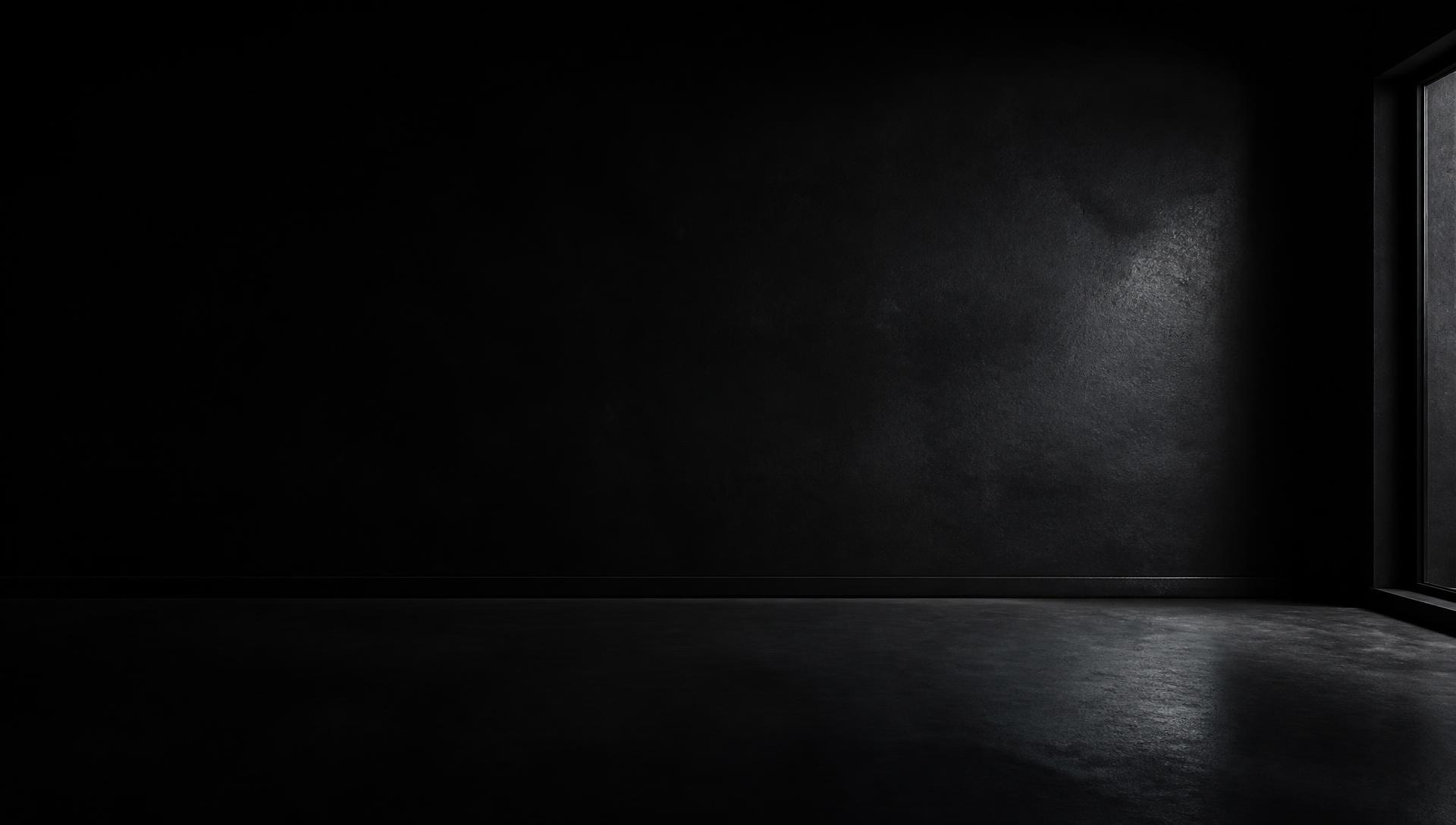 A dark room lit only by the glow of a Wow Wall display